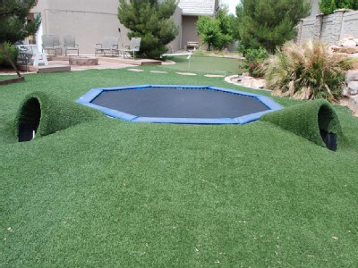 inground trampoline in the backyard