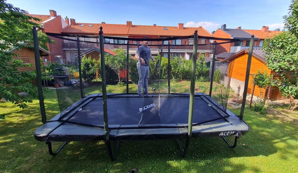 Image of outdoor trampoline with kid jumping - trampoline model Acon Air 16 year 2023