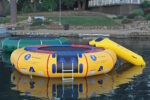 15ft island hopper inflatable trampoline in yellow and green on water