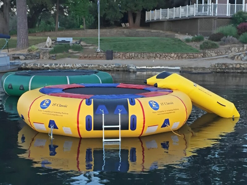 15ft island hopper inflatable trampoline in yellow and green on water