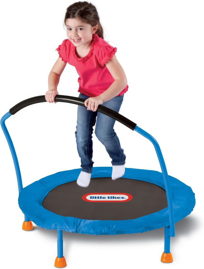 girl, perhaps non binary, enjoying on little tikes 3 trampoline