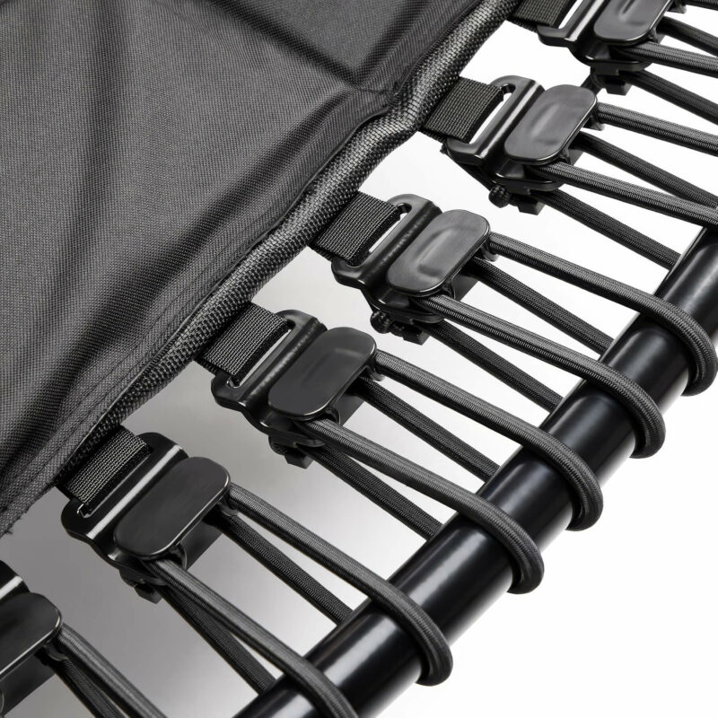 A close-up view of durable and adjustable elastic bungee cords securing the jumping mat to the trampoline frame, ensuring a stable and quiet bounce.